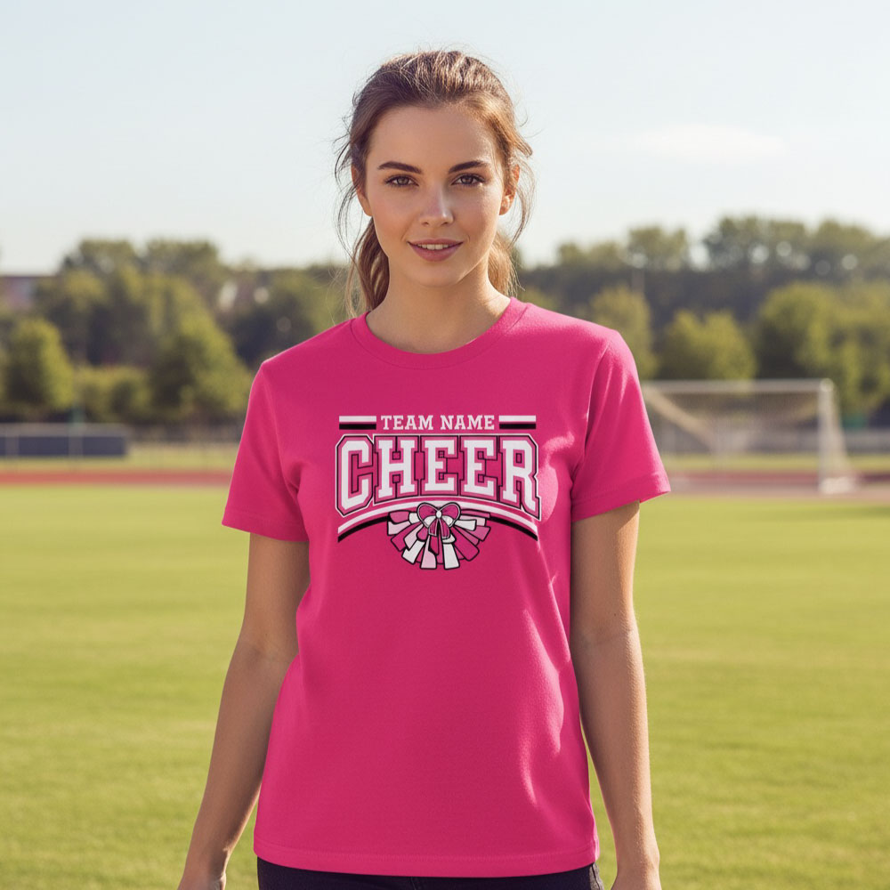 Female model wearing a bright pink custom Pink Out cheer T-shirt with a personalized team name for breast cancer awareness fundraising.