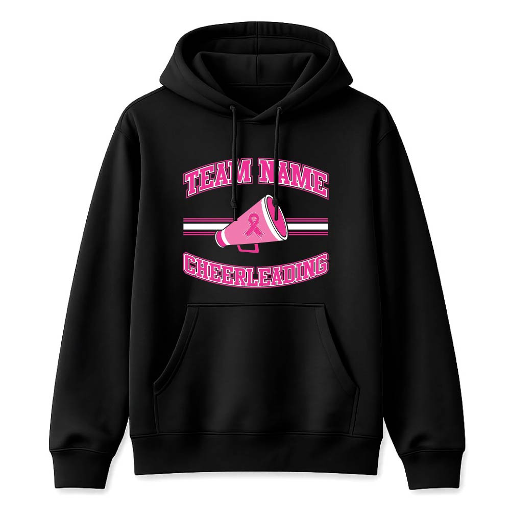Black hoodie featuring a pink cheerleading logo with temporary 'TEAM NAME' text and a pink megaphone graphic, plus a breast cancer awareness ribbon sequence in the design.