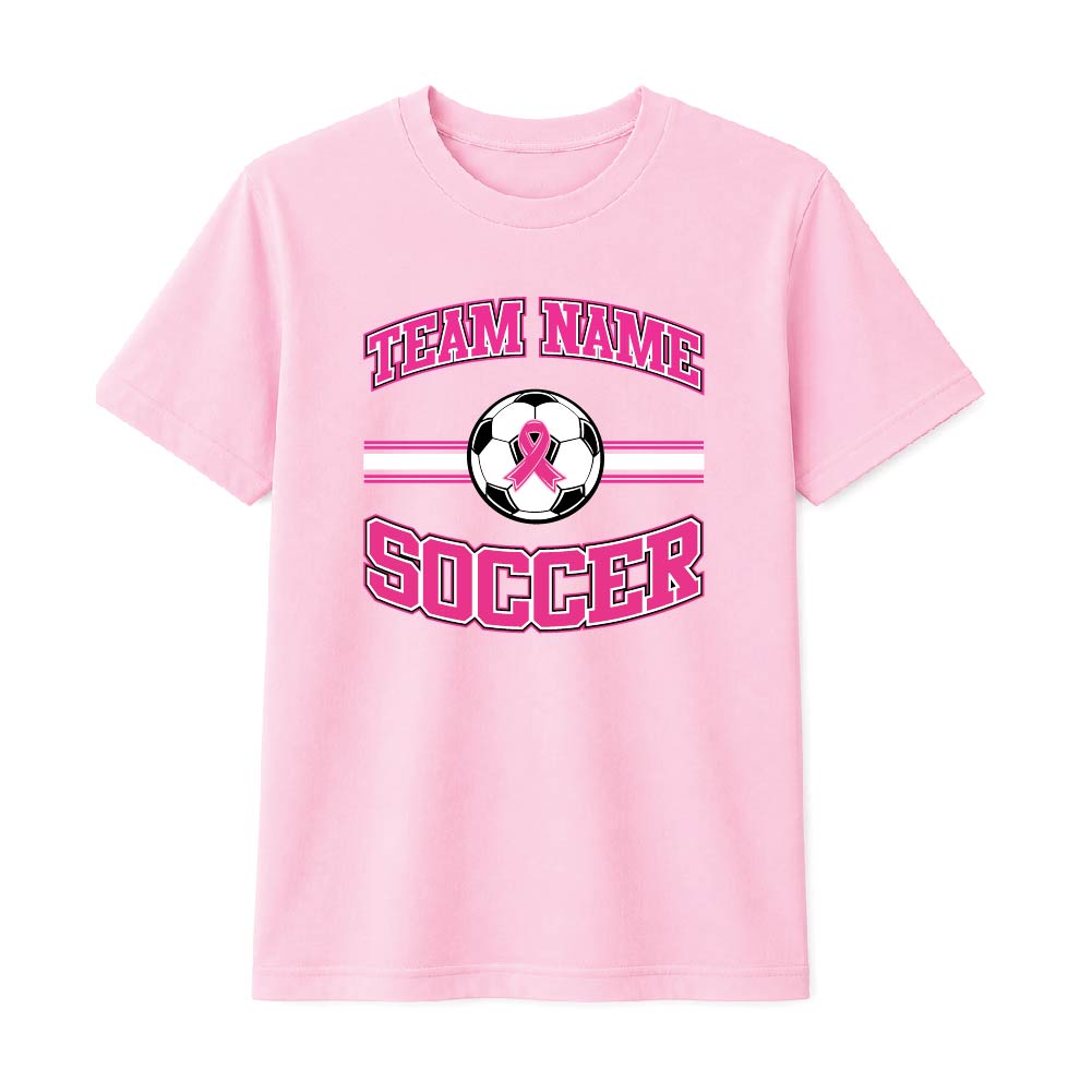 Pink soccer breast cancer awareness design featuring a soccer with a pink ribbon, customizable team name, and varsity-style "Soccer" text.