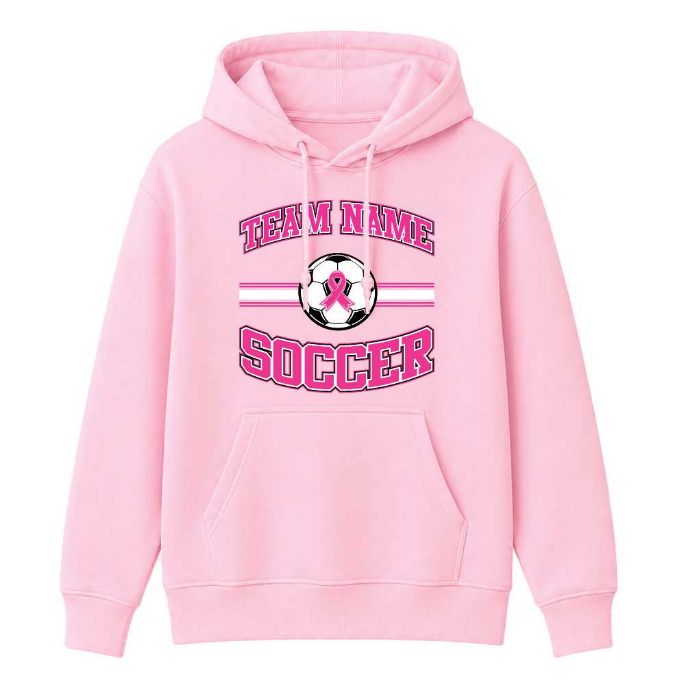 Pink hoodie featuring a soccer logo, pink ribbon, and 'TEAM NAME SOCCER' text on the chest; front kangaroo pocket visible.
