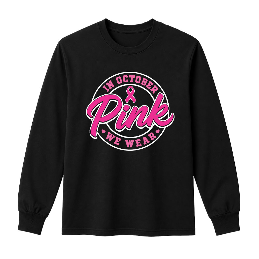 Circular "In October We Wear Pink" breast cancer awareness design featuring a pink ribbon and bold script lettering for custom Pink Out shirts and fundraiser apparel.
